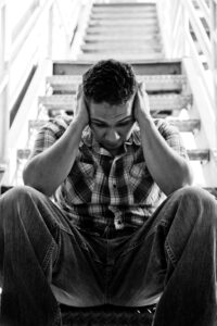 A man experiencing signs and symptoms of social anxiety disorder